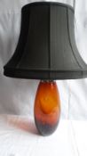 A PAIR OF AMBER GLASS AND CHROME LAMP BASES 39 cms, WITH BLACK MOIRE SILK SHADES (2)