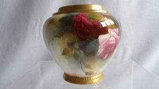 A ROYAL WORCESTER PORCELAIN POT, HAND PAINTED WITH ROSES IN THE " HADLEY " STYLE, ON AN IVORY