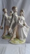 A PAIR OF TENGRA VALENCIA PORCELAIN FIGURES OF A BRIDE AND GROOM. 26 cms. (2)