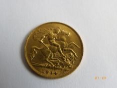 A 1914 GEORGE V GOLD HALF SOVEREIGN