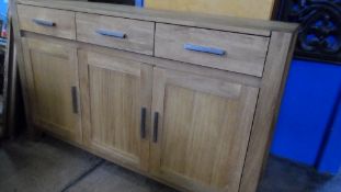 A OAK SIDEBOARD WITH CUTLERY DRAWERS TO TOP