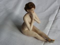 AN ANTIQUE MINIATURE PORCELAIN FIGURE OF AN UNROBED BALLERINA WITH HANDS CLASPED POSSIBLY GERMAN,