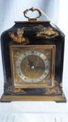 A BLACK LACQUER CHINOISERIE MANTLE CLOCK, BLACK ROMAN NUMERALS ON A BRASS FACE. 16 X 24 cms