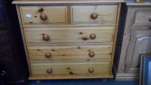 A MODERN PINE CHEST, HAVING TWO SHORT AND THREE LONG DRAWERS ON TURNED FEET, APPROX. 90 X 45 X 42