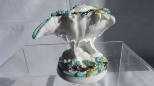 A VICTORIAN PORCELAIN POSY VASE, THE VASE BEING SHELL SHAPED WITH TURQUOISE FLOWERS APPROX 9cms