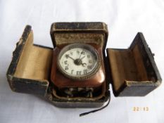 A FRENCH COPPER CASED TRAVELLING ALARM CLOCK IN ORIGINAL CASE INSCRIBED BREVETE