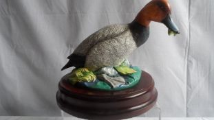 A CROWN STAFFORDSHIRE FIGURE OF A POCHARD WATER FOWL, MODELLED BY SIR PETER MARKHAM SCOTT ( 1909 -