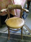 A VINTAGE OAK BENT WOOD ELBOW CHAIR