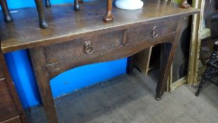 AN ARTS AND CRAFTS OAK DRESSING TABLE HAVING TWO DRAWERS ON STRAIGHT LEGS AND TURNED FEET, APPROX.