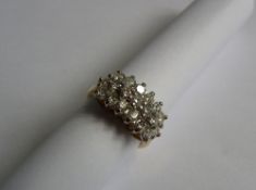 A LADY`S 18ct YELLOW GOLD DIAMOND CLUSTER RING SET WITH NINETEEN STONES, 6 CTS EACH - 1.14 CTS