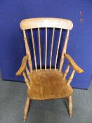 AN ANTIQUE OAK FARMHOUSE SPINDLE BACK ELBOW CHAIR TOGETHER WITH TWO KITCHEN CHAIRS (3)