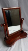 A MAHOGANY VANITY MIRROR