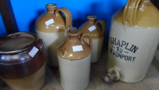 A COLLECTION OF MISCELLANEOUS POTTERY FLAGONS INCLUDING A CHAPLIN DEVONPORT IMPRESS MARK PRICE 22