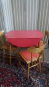 A VINTAGE RETRO DROP LEAF KITCHEN TABLE AND THREE CHAIRS HAVING RED FORMICA TOP 91 x 91 x 76 cms