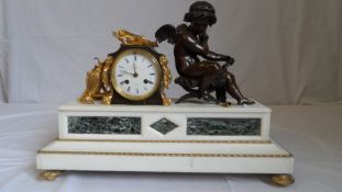 A CIRCA 19TH CENTURY BRONZE AND ORMULU MANTLE CLOCK DEPICTING A CHERUB ON A MARBLE BASE BY DENTS