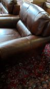 A BROWN LEATHER SINGLE SEATER ARM CHAIR MADE IN ITALY BY SOFATELLA