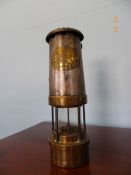 A VINTAGE BRASS AND METAL MINER`S SAFETY LAMP BY THOMAS & WILLIAMS, ABERDARE