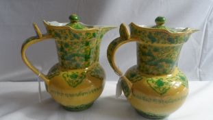 A PAIR OF CHINESE FAMILLE VERT PORCELAIN STEPPED RIM LIDDED WINE POTS HAVING XUANDE CHARACTER MARK