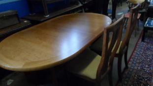 A SKOBBY DANISH TEAK DINING TABLE TOGETHER WITH FOUR DINING CHAIRS.