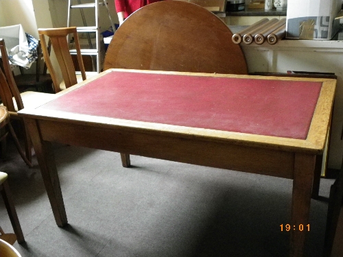 A CIRCA 1930`S OAK THREE DRAWER WORKING DESK WITH RED LEATHERETTE TOP, APPROX. 150 X 90 X 77 cms