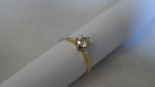 AN 18 ct YELLOW GOLD DIAMOND SOLITAIRE RING SET WITH A BRILLIANT CUT DIAMOND APPROX 35 pts.