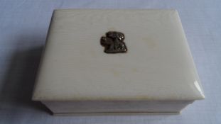 AN ANTIQUE IVORY CIGARETTE BOX HAVING A FIGURE OF AN ELEPHANT AND A PALM TREE TO THE TOP, APPROX. 11