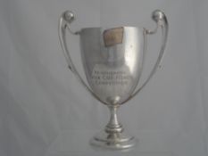 Solid silver Regimental Sporting Trophy. The twin handled trophy inscribed ‘Presented to the