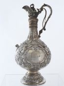 Solid silver Victorian Regimental Claret Jug dated 1880.  The large jug featuring classical frieze