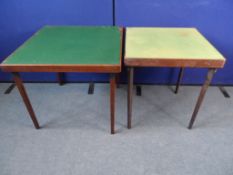 Two Folding Games Tables. The table tops being covered in green baize material, approx. 72 x 75 x 66
