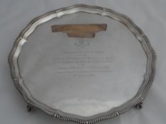 Solid silver Regimental Salver. The salver features a scalloped and ribbon edge on ball and claw