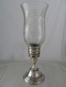 Solid silver Candle Holder. The solid silver candle holder in the form of a vintage oil lamp with