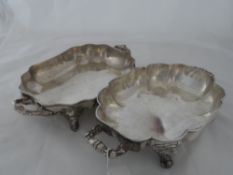 Five silver plated Regimental Arm Tray Dishes. The dishes with twin handle and scrolled feet some