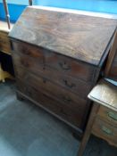 A Victorian Mahogany Bureau. The bureau having drawers and pigeon holes fitted to the interior