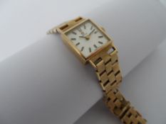 A Lady`s Omega 9ct yellow gold vintage wrist watch, the wristwatch being on a 9ct gold engine turned