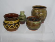 Winchcombe Pottery incl. pouring bowl, milk jug, sugar pot and two vases with various marks (5)