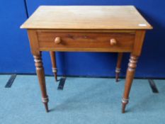 A Victorian Mahogany Hall Table. The table being fitted with one drawer on turned and tapered