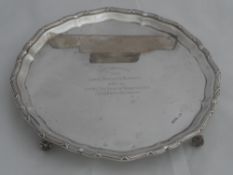 Solid silver Regimental Salver. The salver features a scalloped and reeded edge on floral scroll