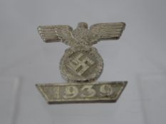 A German 1939 Iron Cross. The cross being second class, two blades miniature type.