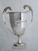 Solid silver Regimental Presentation Trophy. The octagonal twin handled trophy inscribed ‘1st