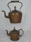 An Antique Copper Kettle together with a similar smaller kettle, both kettles having finials to