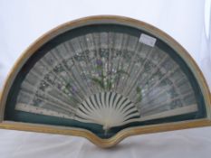 An Antique Hand Painted Lady`s Fan, the fan having ivory sticks with hand painted flowers