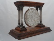 White metal Dinner Gong. The gong supported by four Corinthian columns, on Oak plinth, inscribed ‘