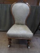 Victorian Walnut. The chair with silk braids and original porcelain castors