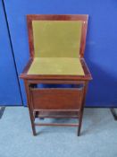 A Victorian Mahogany Card Table. The table having a lift out / drop down shelf, the legs and