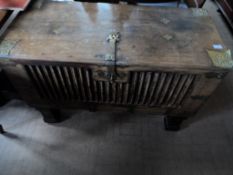 Antique Rhagastani Chest. The chest having a carved front with pierced brass corners and two