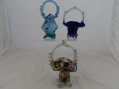 Three Murano style multi coloured glass baskets