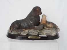 A Collection of Misc. Items incl. resin figure of a seal and pup and a white porcelain of Queen