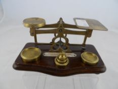 A Set of brass postal scales complete with weights.