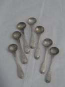 Seven Regimental shell pattern double struck salt spoons. The spoons stamped with the Regimental