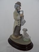 A Lladro Retired Figure " Clown with Sax " Sad Sax 5471 plus free collectors dog.